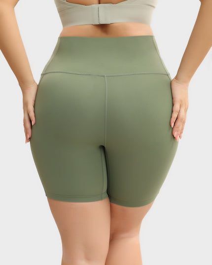 Pantalones cortos de yoga ajustados con levantamiento de cadera y cintura alta de tamaño mediano con bolsillos 